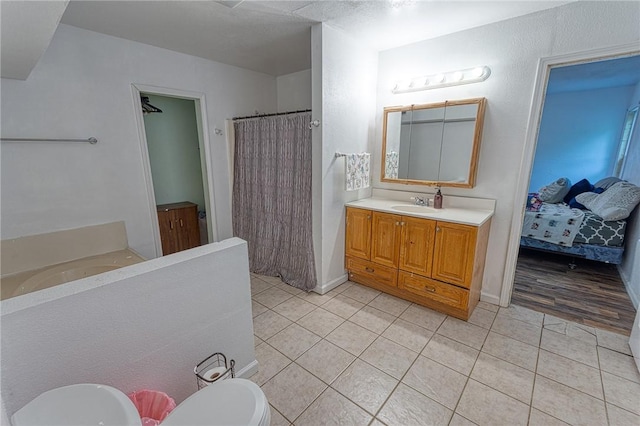 1309 Annapolis Dr, Corpus Christi, TX 78415 - full bath with toilet, tile patterned floors, vanity, and curtained shower