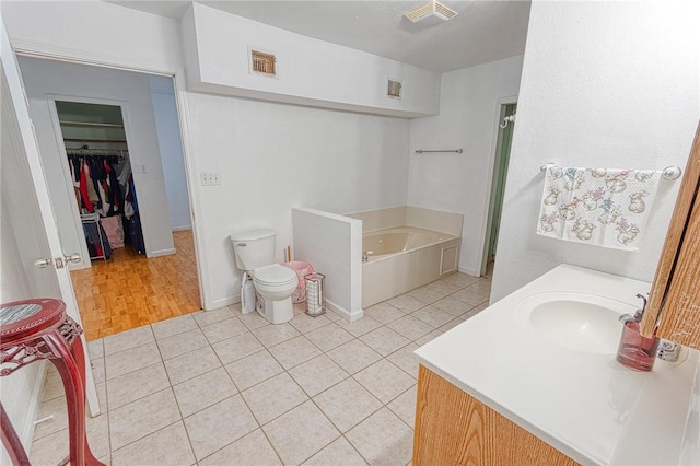 1309 Annapolis Dr, Corpus Christi, TX 78415 - full bath with a bath, tile patterned flooring, a walk in closet, and vanity