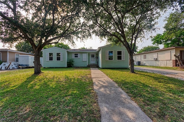 1309 Annapolis Dr, Corpus Christi, TX 78415 - view of front of home featuring a front lawn and central AC