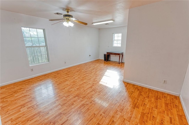 1309 Annapolis Dr, Corpus Christi, TX 78415 - empty room with light wood finished floors, ceiling fan, and baseboards