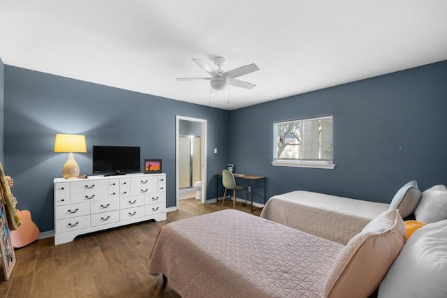 bedroom with dark wood-style floors, ceiling fan, and baseboards