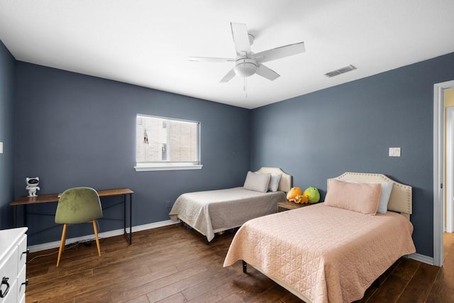 bedroom featuring ceiling fan, dark wood finished floors, visible vents, and baseboards