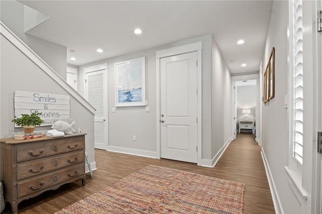 hall with recessed lighting, baseboards, and wood finished floors