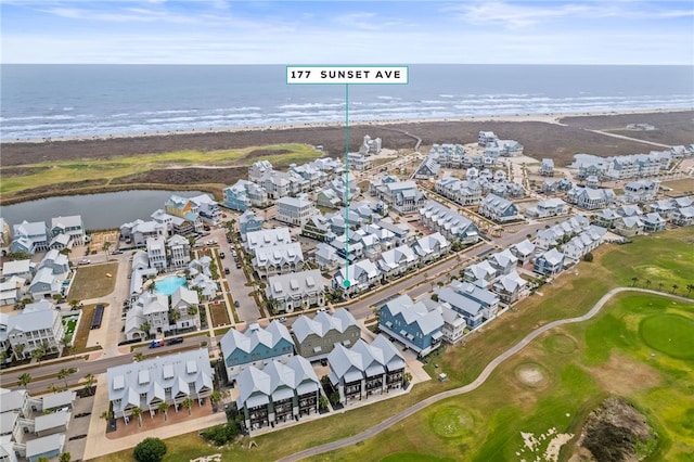 drone / aerial view featuring a water view and a residential view