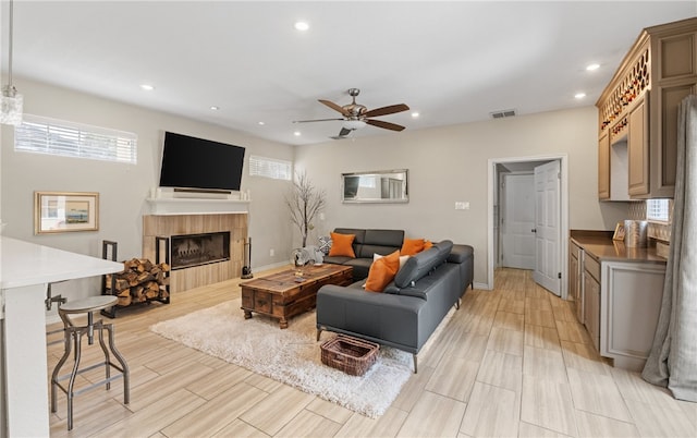 4658 Oso Pkwy, Corpus Christi, TX 78413 - living area featuring ceiling fan, recessed lighting, a fireplace, and light wood-style flooring