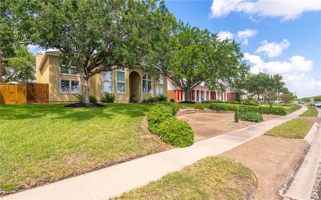 4658 Oso Pkwy, Corpus Christi, TX 78413 - view of property hidden behind natural elements featuring stucco siding and a gate