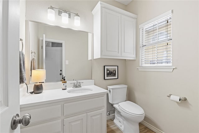 4658 Oso Pkwy, Corpus Christi, TX 78413 - half bath featuring vanity and wood finished floors