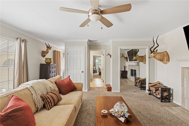 4658 Oso Pkwy, Corpus Christi, TX 78413 - living area with a tile fireplace, plenty of natural light, carpet, crown molding, and ceiling fan