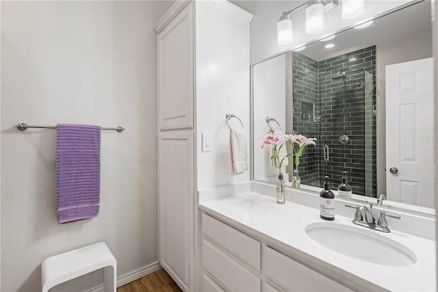 4658 Oso Pkwy, Corpus Christi, TX 78413 - full bath with vanity, a tile shower, and wood finished floors