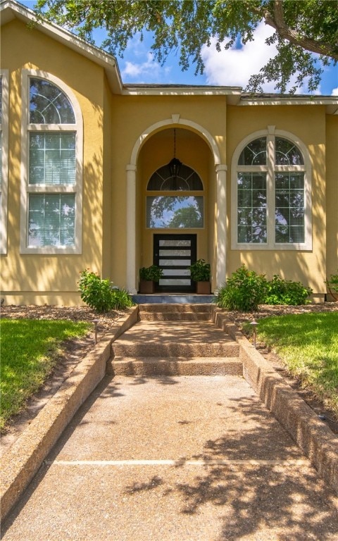 4658 Oso Pkwy, Corpus Christi, TX 78413 - doorway to property featuring stucco siding