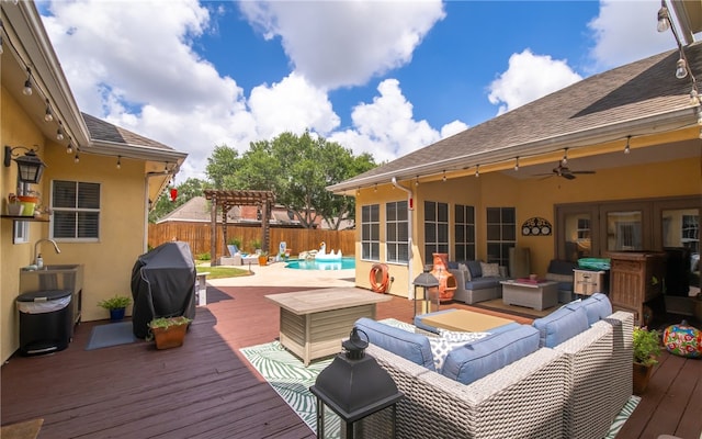 4658 Oso Pkwy, Corpus Christi, TX 78413 - wooden deck featuring outdoor lounge area, area for grilling, a fenced backyard, and a ceiling fan
