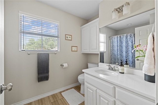 4658 Oso Pkwy, Corpus Christi, TX 78413 - bathroom with plenty of natural light, vanity, wood finished floors, and a shower with curtain
