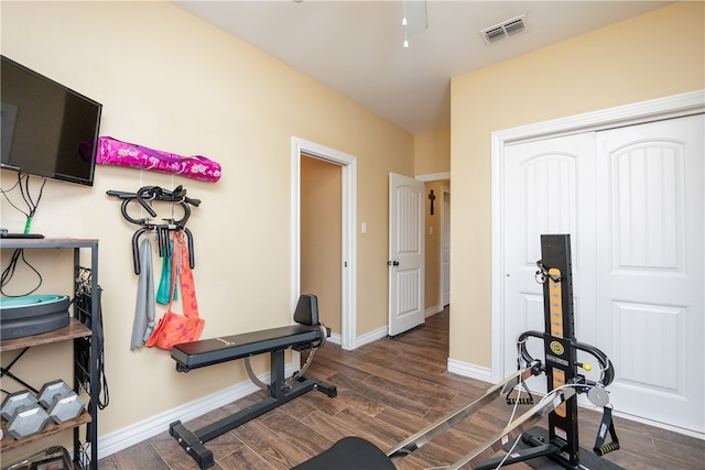 exercise area with dark hardwood / wood-style floors