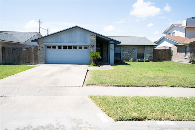 ranch-style home featuring a garage and a front lawn