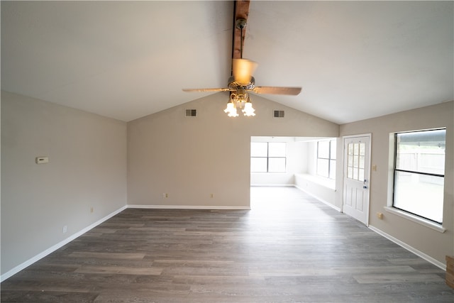 unfurnished living room with ceiling fan, vaulted ceiling, and dark hardwood / wood-style floors