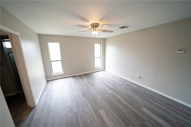 unfurnished room with hardwood / wood-style flooring and ceiling fan