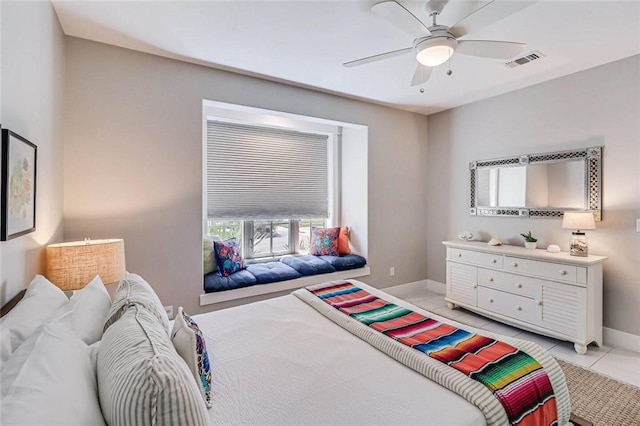 tiled bedroom with ceiling fan