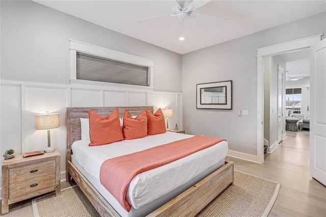 bedroom with ceiling fan and wood-type flooring