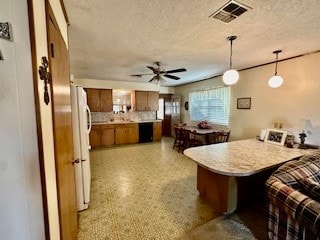 kitchen featuring decorative light fixtures, kitchen peninsula, a textured ceiling, and ceiling fan