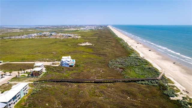 bird's eye view featuring a water view and a view of the beach