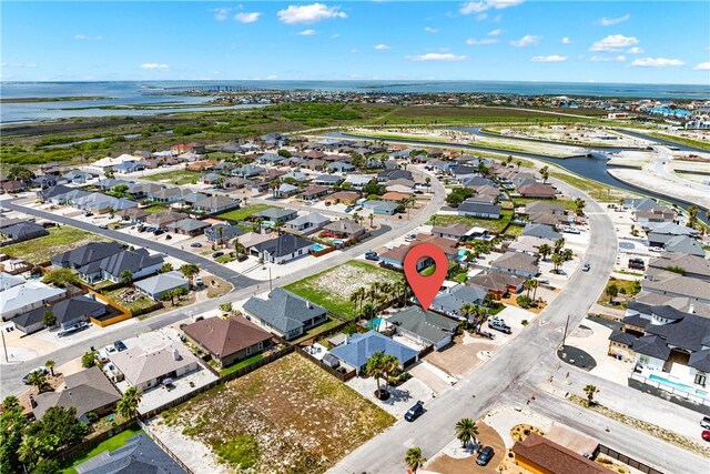 14825 Dasmarinas Dr, Corpus Christi, TX 78418 - aerial overview of property's location featuring a large body of water and nearby suburban area