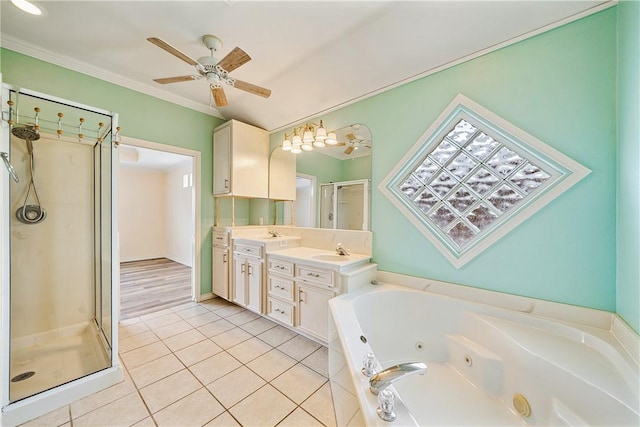 14825 Dasmarinas Dr, Corpus Christi, TX 78418 - bathroom featuring double vanity, a shower stall, a tub with jets, ceiling fan, and tile patterned floors