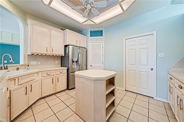 14825 Dasmarinas Dr, Corpus Christi, TX 78418 - kitchen with stainless steel fridge with ice dispenser, light tile patterned floors, backsplash, a ceiling fan, and light countertops