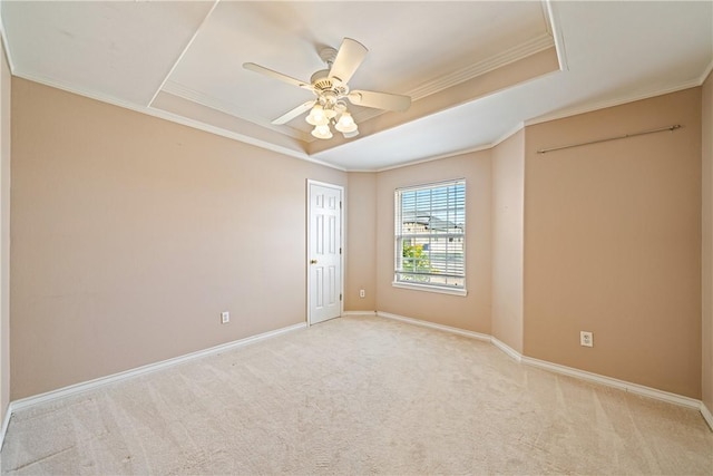 14825 Dasmarinas Dr, Corpus Christi, TX 78418 - unfurnished room with light carpet, a tray ceiling, crown molding, baseboards, and ceiling fan