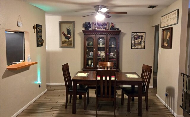 9334 Moon Beam, Corpus Christi, TX 78409 - dining room featuring a ceiling fan, wood finished floors, and baseboards