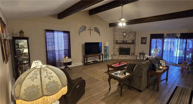 9334 Moon Beam, Corpus Christi, TX 78409 - living area featuring a ceiling fan, wood finished floors, and a brick fireplace