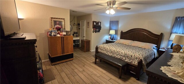 9334 Moon Beam, Corpus Christi, TX 78409 - bedroom featuring light wood-type flooring, baseboards, and ceiling fan