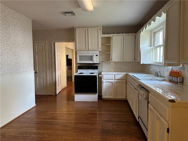 3102 Topeka St, Corpus Christi, TX 78404 - kitchen featuring white appliances, wallpapered walls, tile countertops, open shelves, and dark wood-style flooring