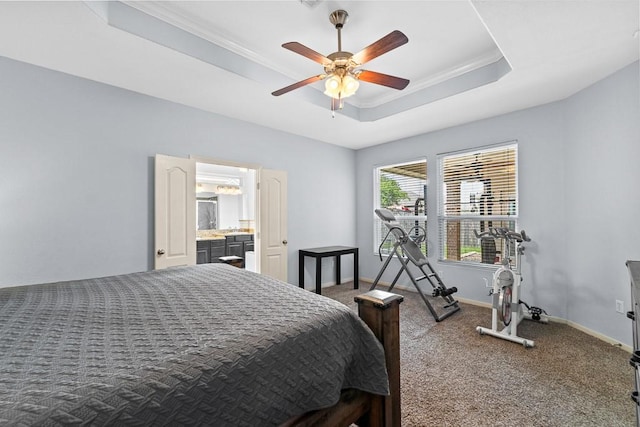 bedroom featuring baseboards, carpet flooring, a tray ceiling, and ornamental molding