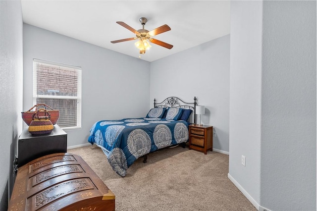 bedroom with baseboards, carpet flooring, and a ceiling fan