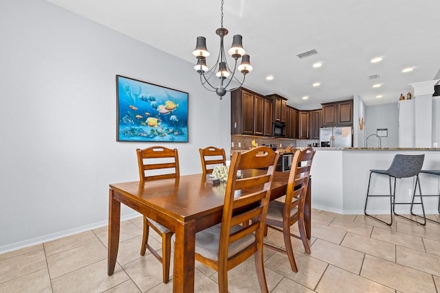 dining space with visible vents, recessed lighting, light tile patterned floors, and a chandelier