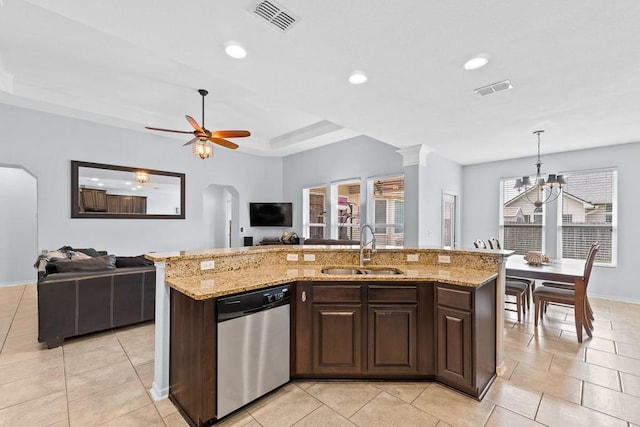 kitchen with a healthy amount of sunlight, visible vents, stainless steel dishwasher, a sink, and open floor plan