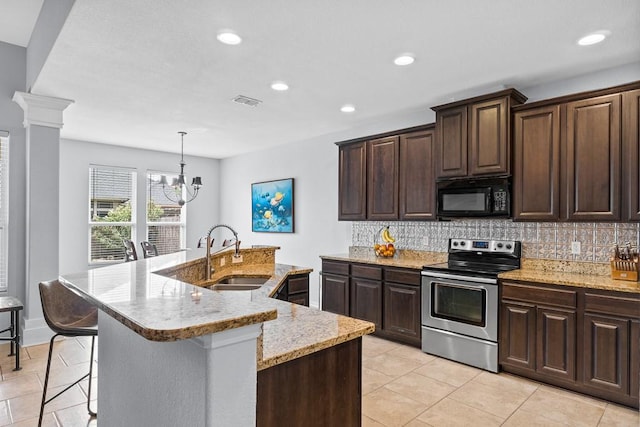 kitchen featuring decorative backsplash, black microwave, recessed lighting, a sink, and stainless steel electric range oven