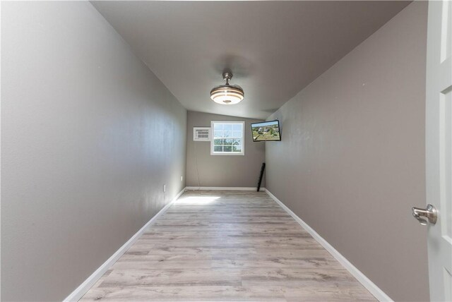 132 Zenna Dr, Mathis, TX 78368 - hallway with vaulted ceiling, light wood-style floors, and baseboards