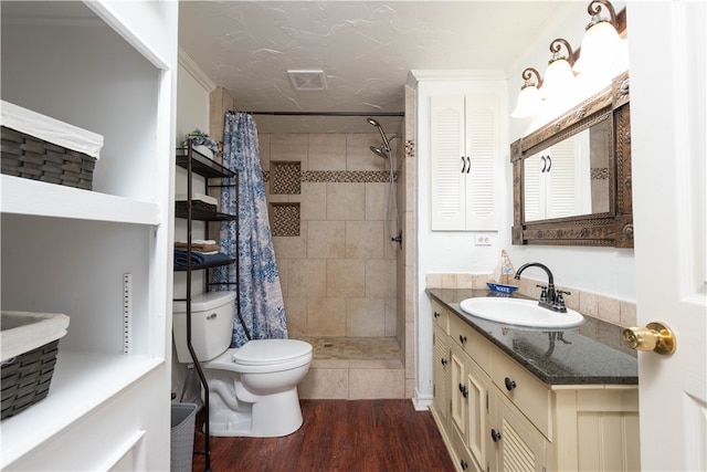 bathroom featuring toilet, vanity, wood-type flooring, and a shower with shower curtain