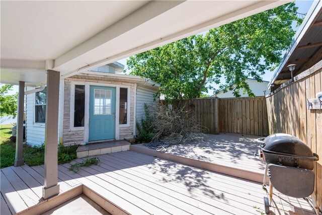 132 Zenna Dr, Mathis, TX 78368 - wooden terrace with grilling area and fence