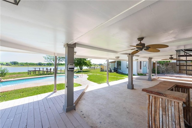 132 Zenna Dr, Mathis, TX 78368 - view of patio with ceiling fan, an outdoor pool, and a deck with water view