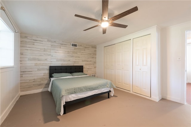 bedroom with concrete flooring and ceiling fan