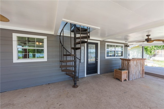 exterior space featuring ceiling fan