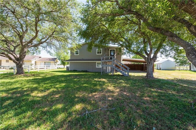 132 Zenna Dr, Mathis, TX 78368 - rear view of house with stairway