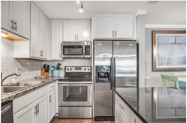 kitchen featuring white cabinetry, appliances with stainless steel finishes, and sink