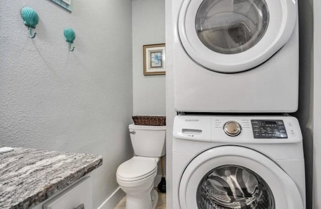 laundry room featuring stacked washer / dryer