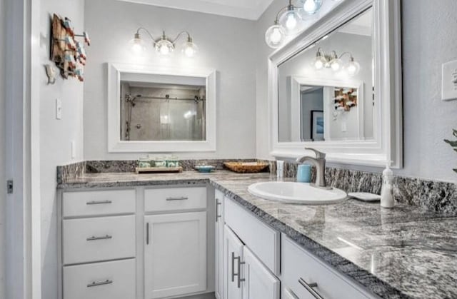 bathroom with vanity and a shower