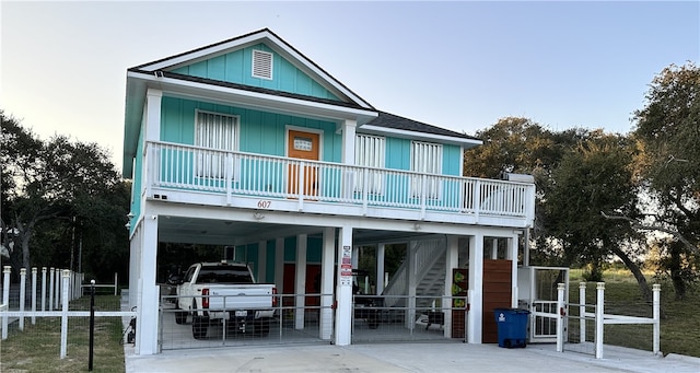 back of property featuring a carport