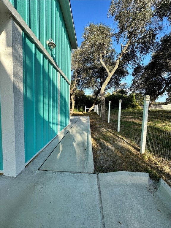 view of side of property featuring a patio