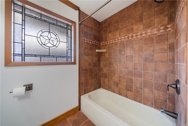 bathroom featuring tile patterned floors and tiled shower / bath